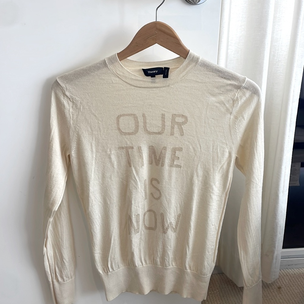 Theory 53% silk and 43% cashmere sweater with words on it